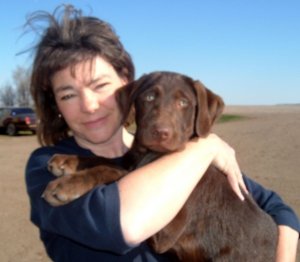 Mom holds the new family pooch!