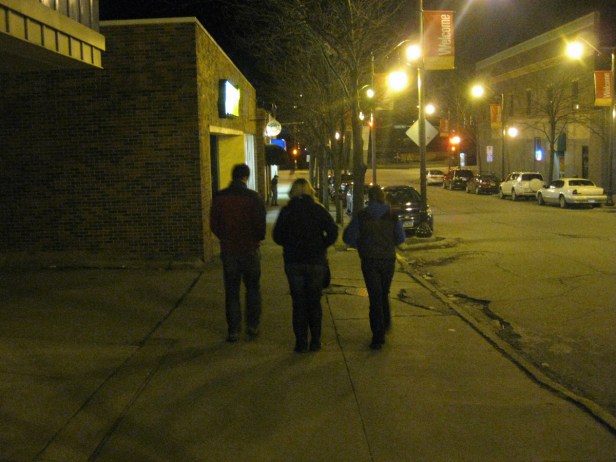IOWA: Lauren and her brother and sister walk down the street of Ames at night.