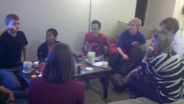 Friends gathering at our board game party Saturday night