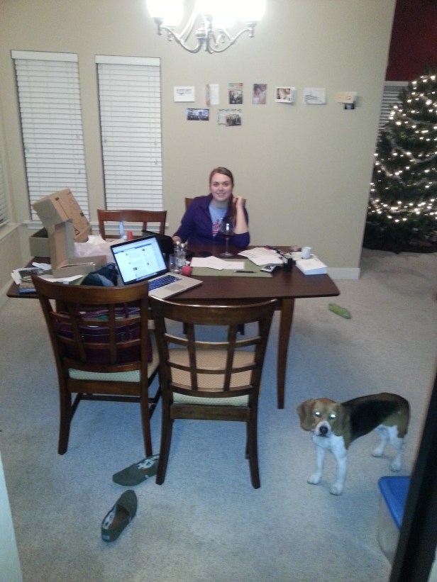 Lauren and Baxter address Christmas cards while listening to Christmas carols near the Christmas tree in preparation for Christmas.