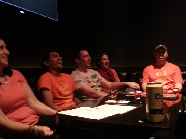 The karaoke gang looks on at an amusing performance.