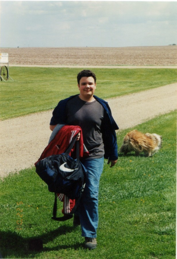 Alex arrives home from school.