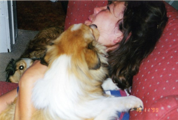 Simba Sue (?) licking Mom's face.