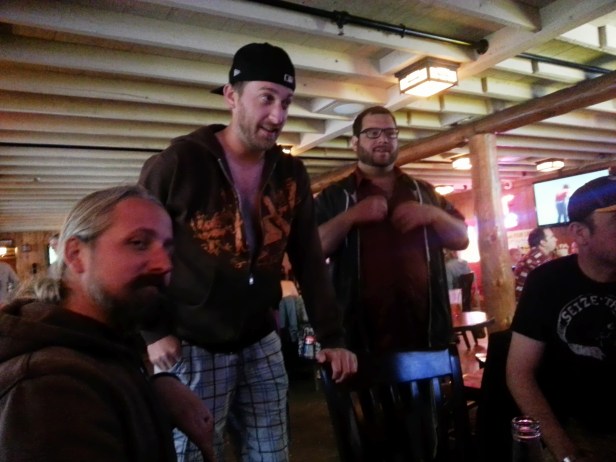 Jeremy, Chris, and Bradley warm up after a chilly pontoon ride.