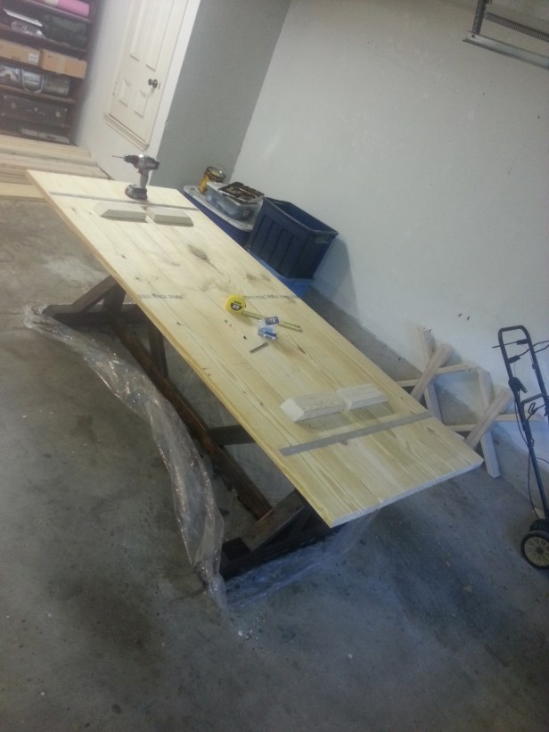 The bottom of the table: 4 board being held together by some strips of metal and some braces.