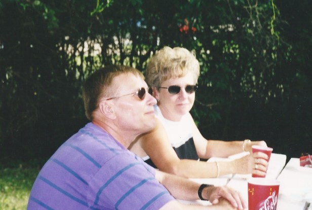 Our high school science teacher (and by all I mean all-Mom, Dad, me, Jordan, and Alex) Mr. Meyer sitting at a picnic table enjoying a paper cup of Coke.