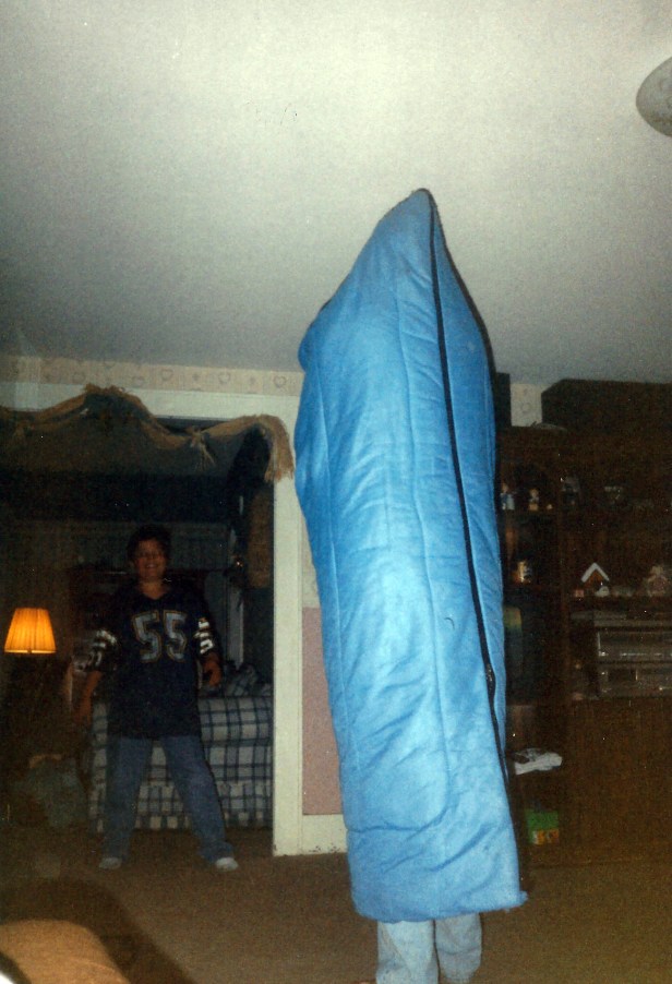 Alex watching someone (probably me) dance around the house with a sleeping bag over my head.