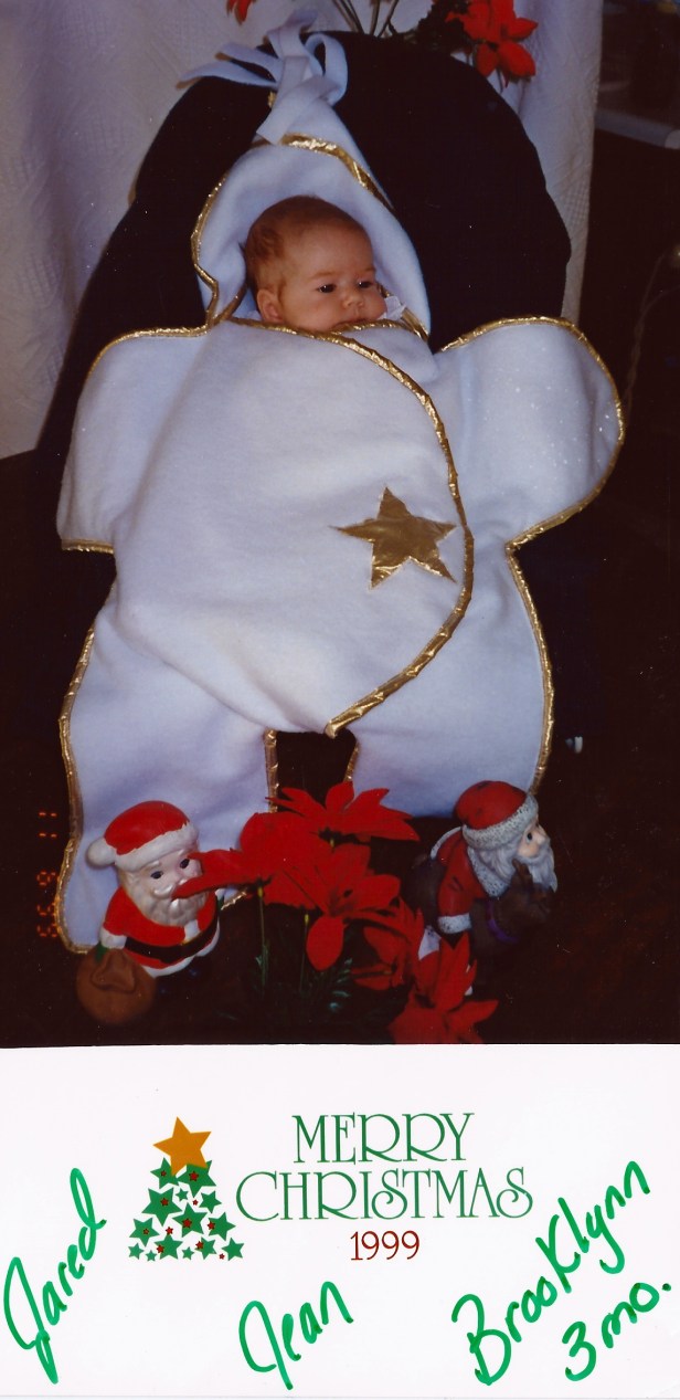 A Christmas card we received from a family friend of a baby in a puffy snowsuit, possibly around 2000 or so.