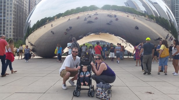 The family takes in Cloud Gate, the famous bean sculpture at Millennium Park in Chicago.