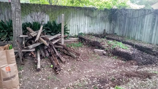 I threw all the rotted wood planks and stakes into a pile... TBD what I'll do to dispose of this within city limits.
